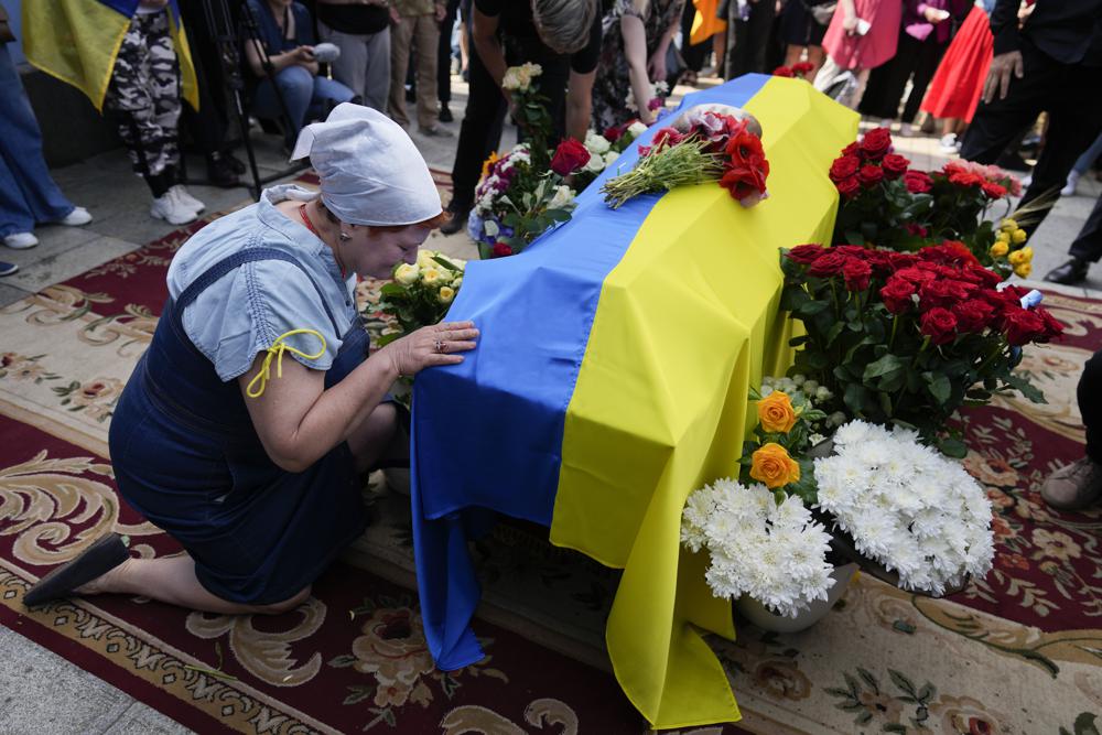 In Ukraine, funeral for activist killed and mourned in war